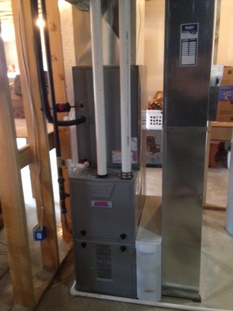 New gas furnace and ductwork installed in a basement